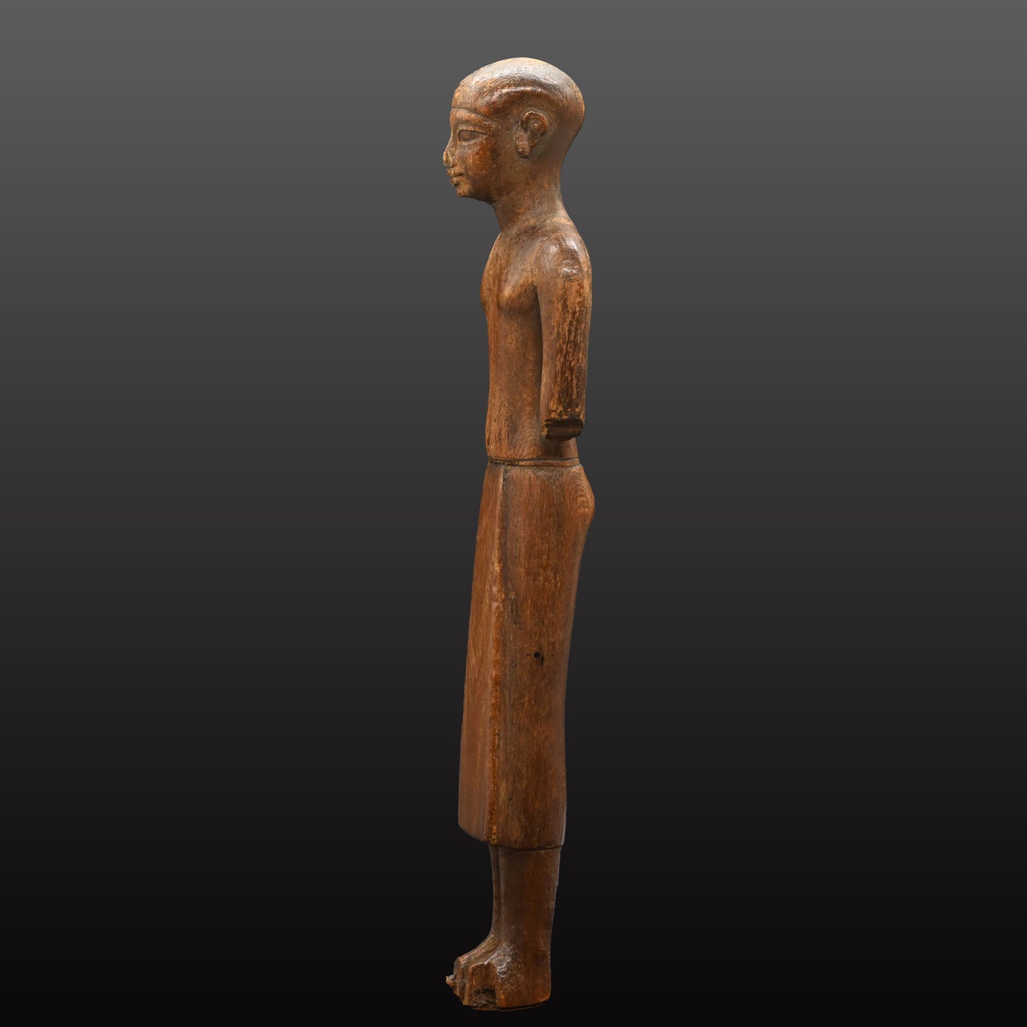 A Fine Egyptian Wooden Standing Dignitary Figure, Middle Kingdom, 11th - 12th Dynasty, ca. 2030 - 1802 BCE