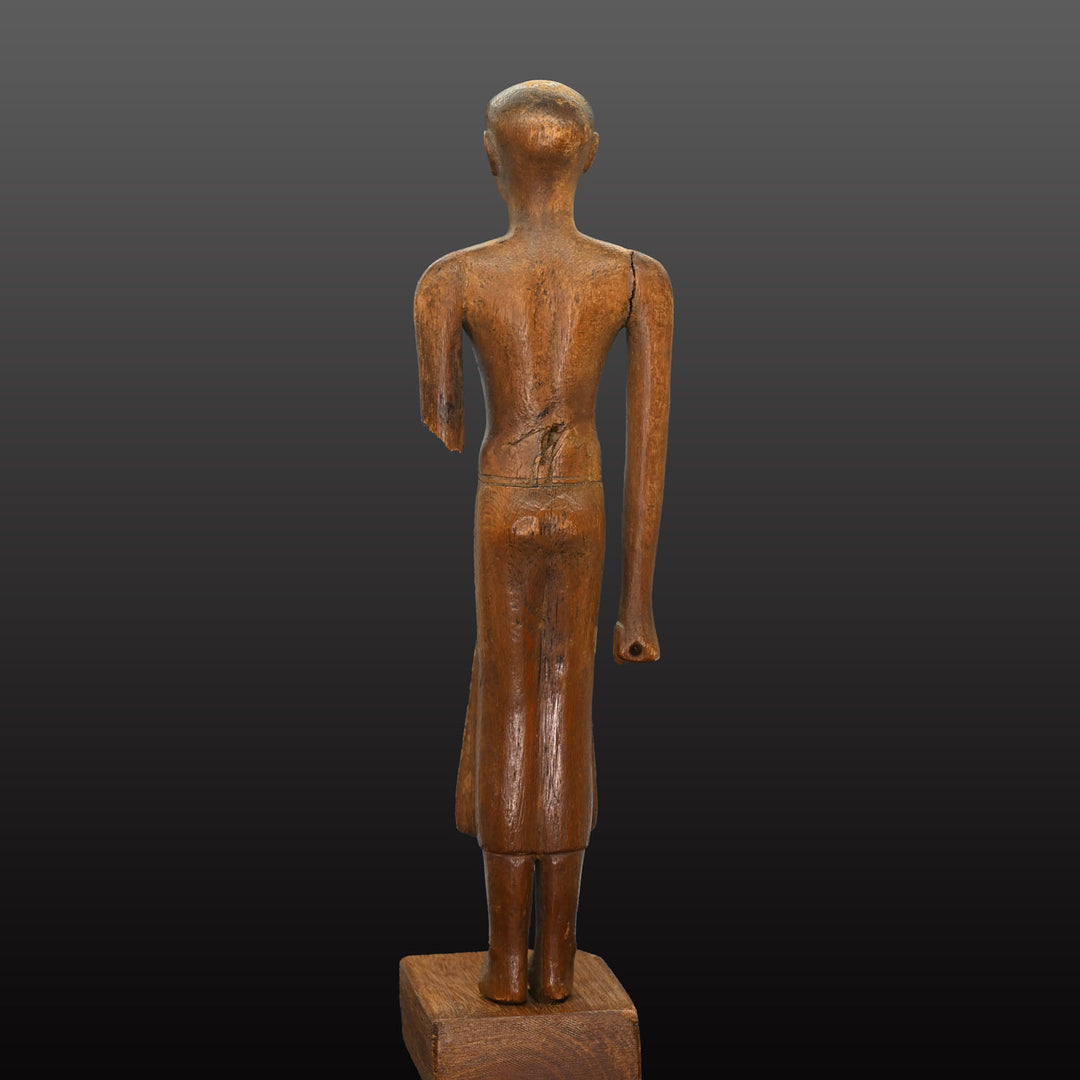 A Fine Egyptian Wooden Standing Dignitary Figure, Middle Kingdom, 11th - 12th Dynasty, ca. 2030 - 1802 BCE