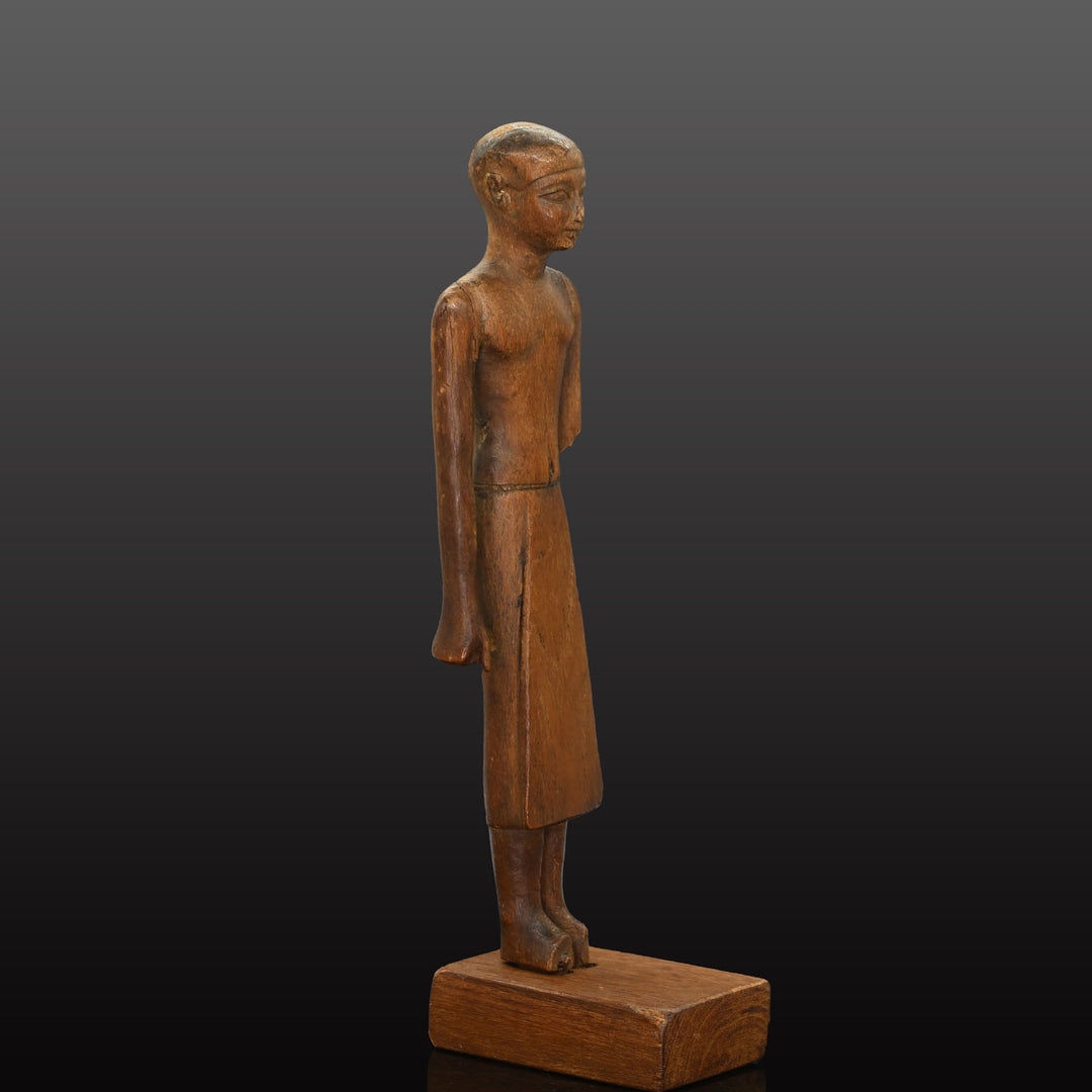 A Fine Egyptian Wooden Standing Dignitary Figure, Middle Kingdom, 11th - 12th Dynasty, ca. 2030 - 1802 BCE