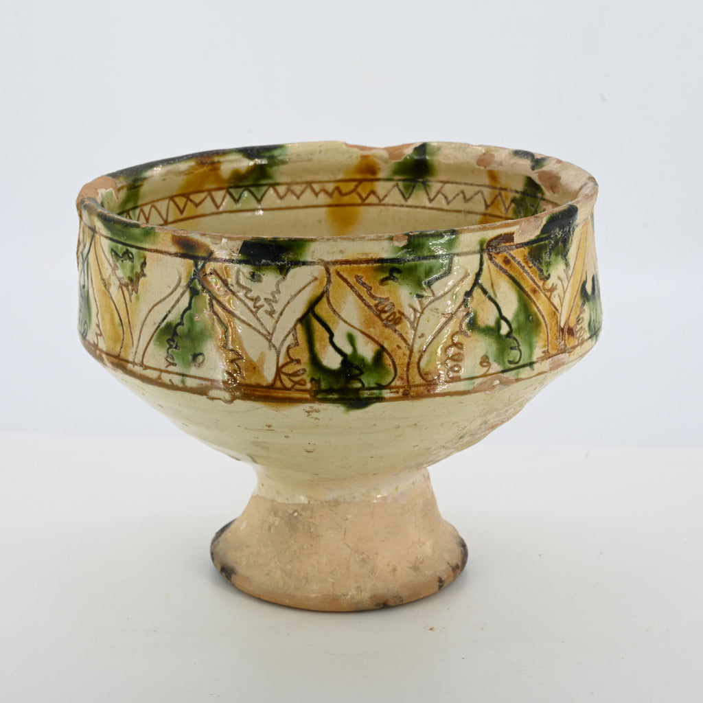 A Byzantine Sgraffito ware footed cup, 14th century CE