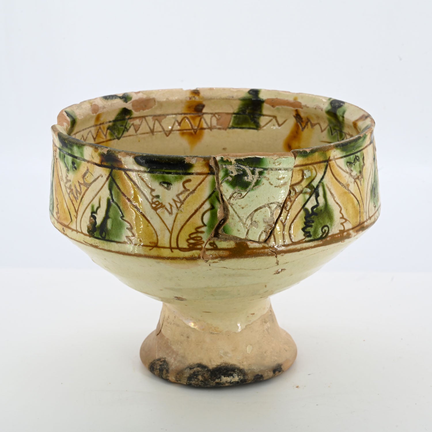 A Byzantine Sgraffito ware footed cup, 14th century CE