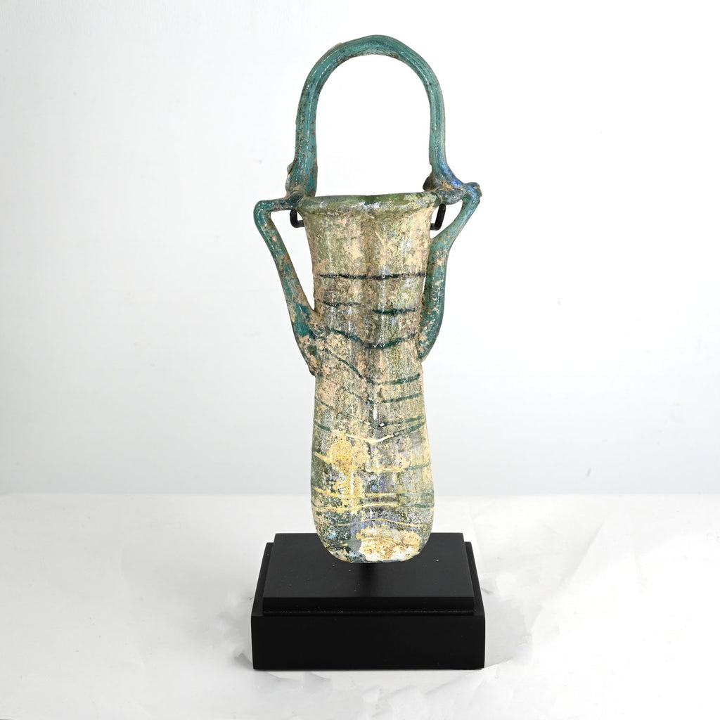 A Roman glass double balsamarium with handle, Roman Imperial Period, ca. 4th century CE