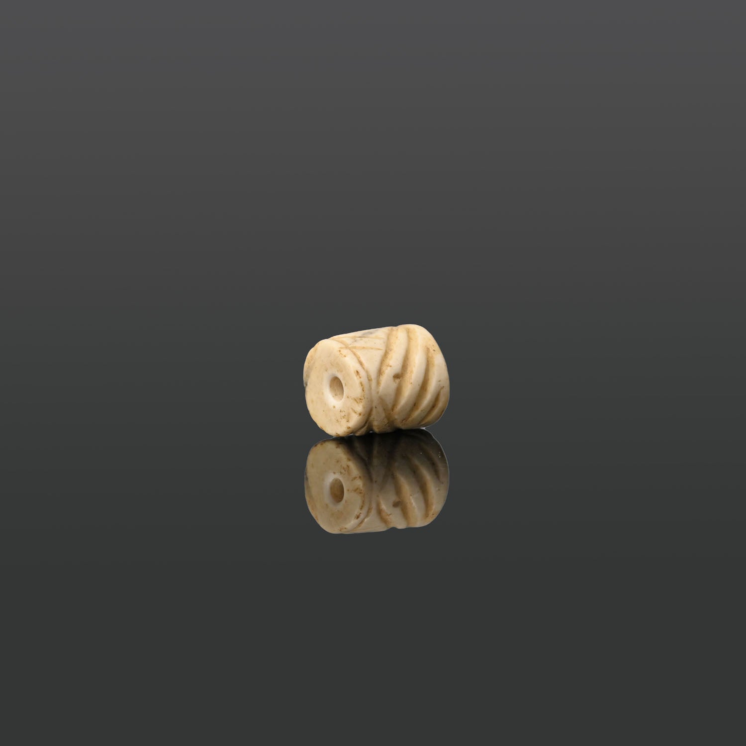 A Mesopotamian Marble Cylinder Seal, Jemdet Nasr Period, ca. 3100 - 2700 BCE