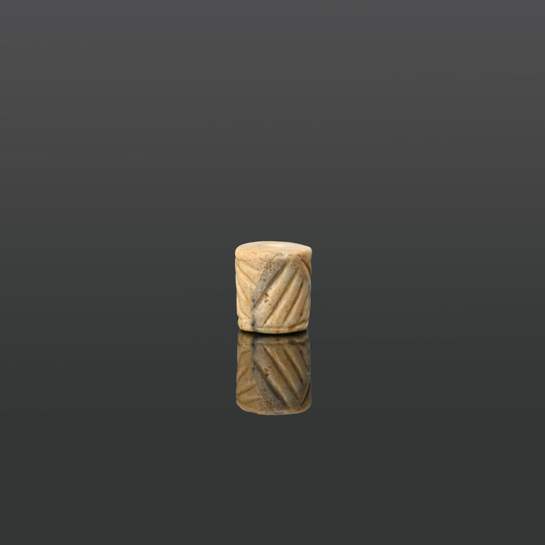 A Mesopotamian Marble Cylinder Seal, Jemdet Nasr Period, ca. 3100 - 2700 BCE