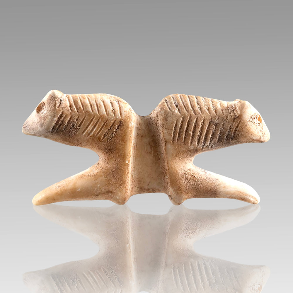 A Mesopotamian Marble Double Lion Amulet, Jemdet Nasr, ca. 3rd - 2nd millennium BCE