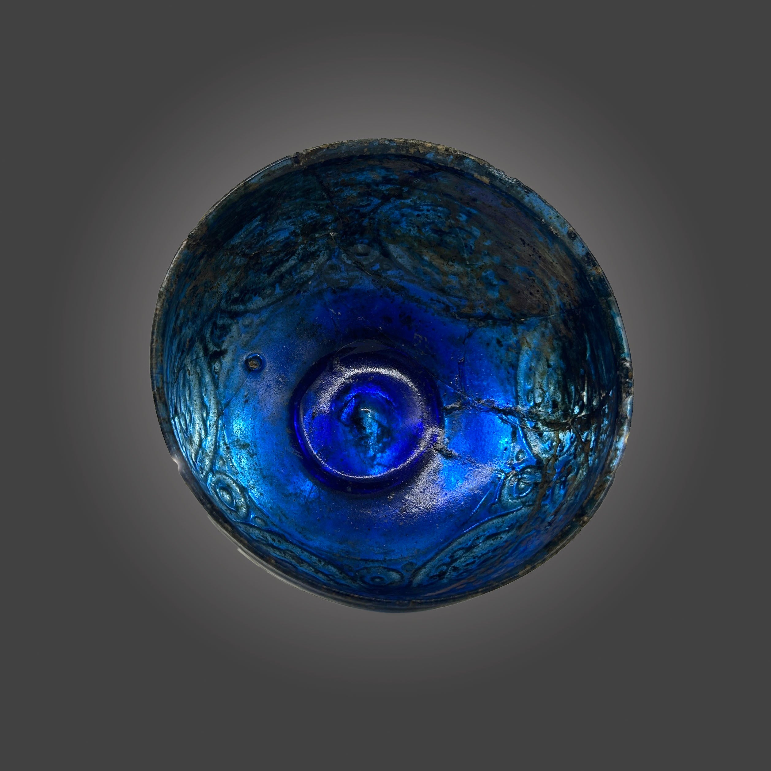 A Rare Islamic Molded Cobalt Blue Glass Bowl, Early Islamic Period, ca. 7th - 10th century CE