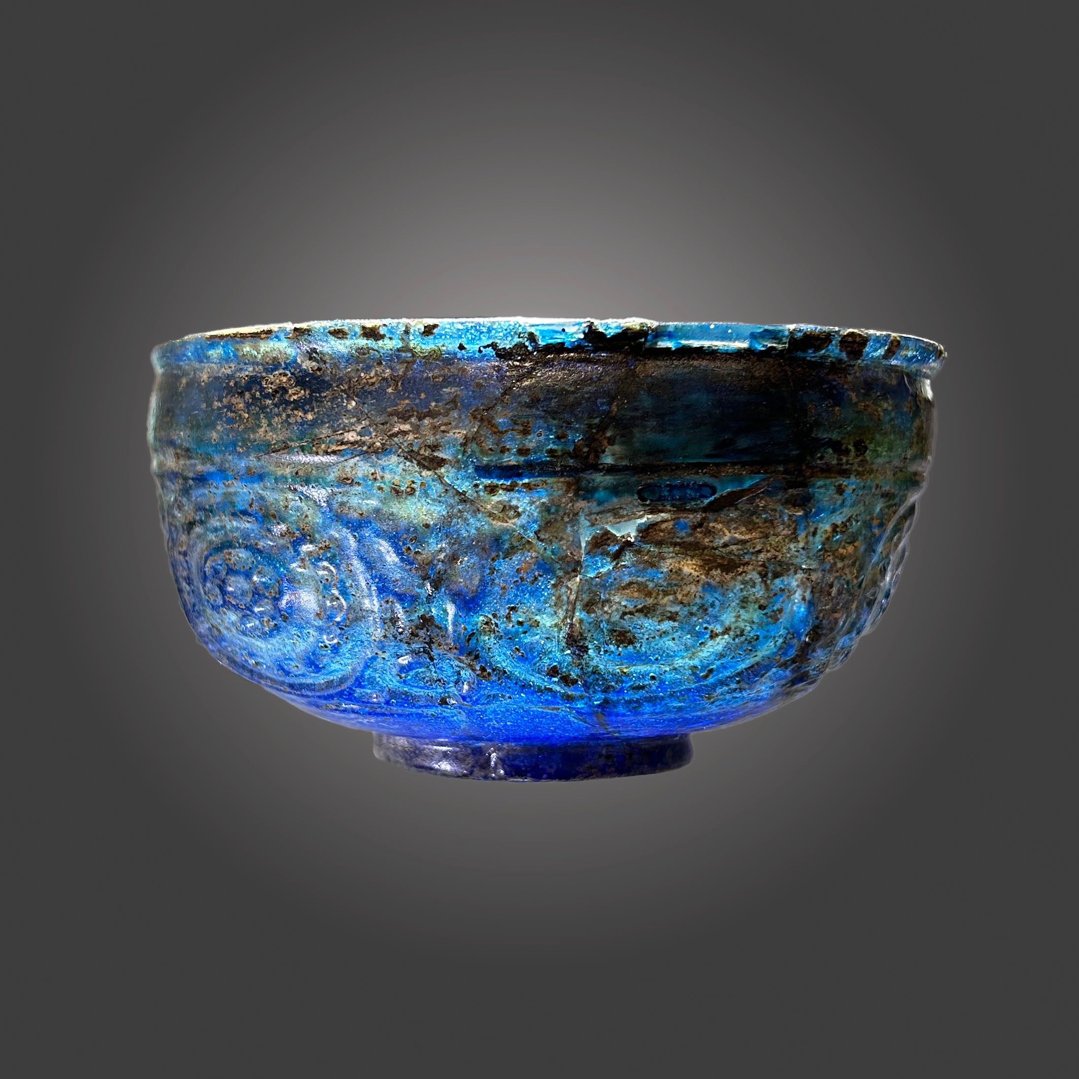 A Rare Islamic Molded Cobalt Blue Glass Bowl, Early Islamic Period, ca. 7th - 10th century CE