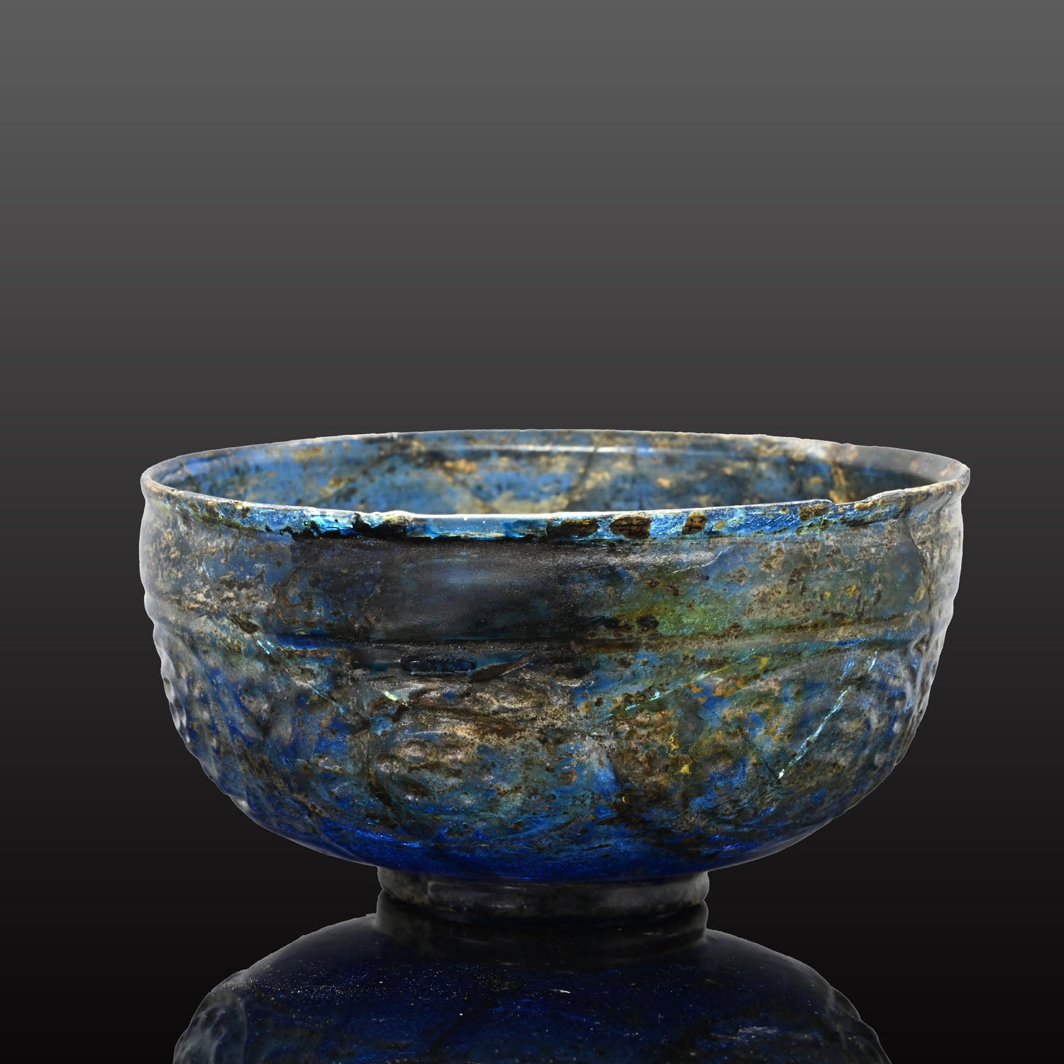 A Rare Islamic Molded Cobalt Blue Glass Bowl, Early Islamic Period, ca. 7th - 10th century CE
