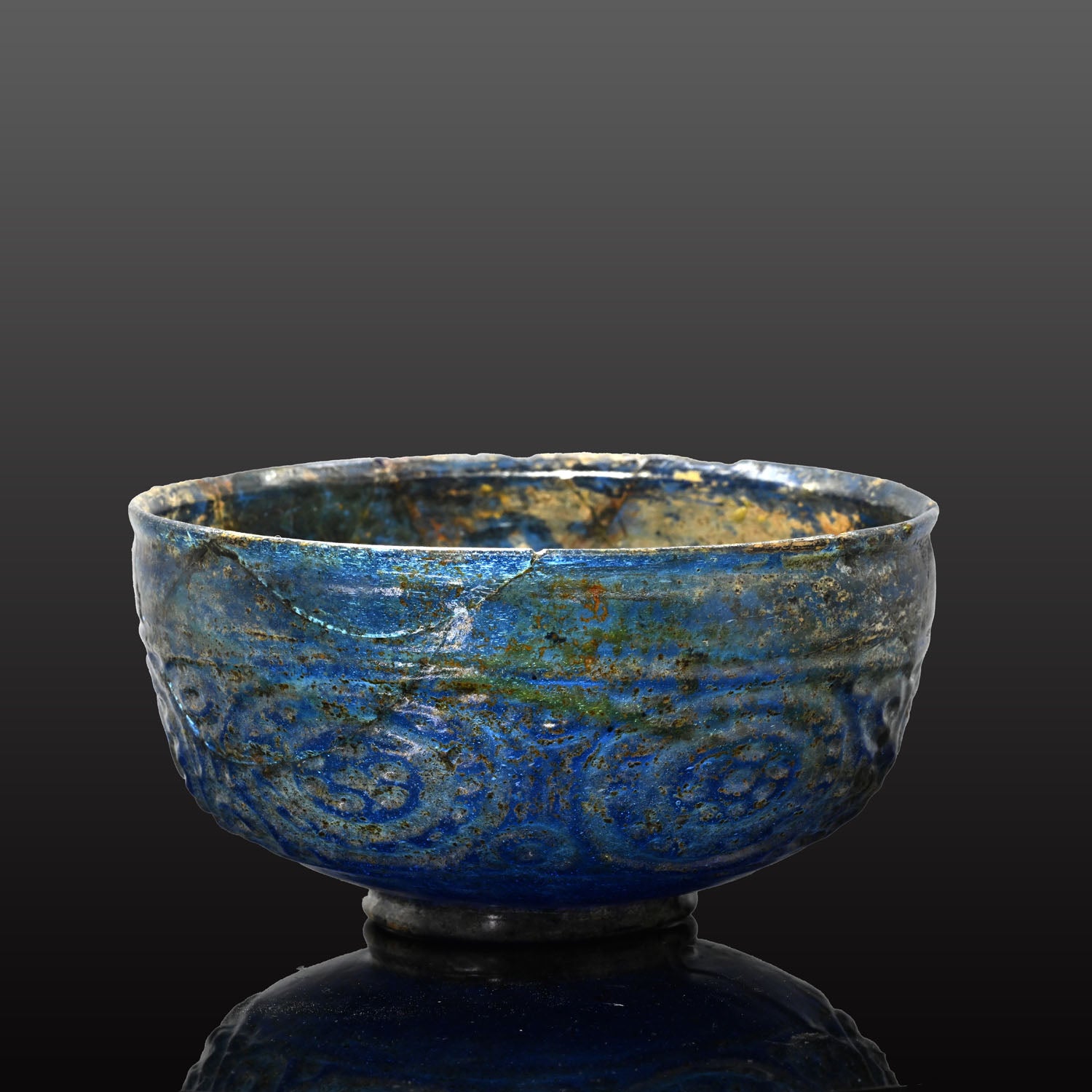 A Rare Islamic Molded Cobalt Blue Glass Bowl, Early Islamic Period, ca. 7th - 10th century CE