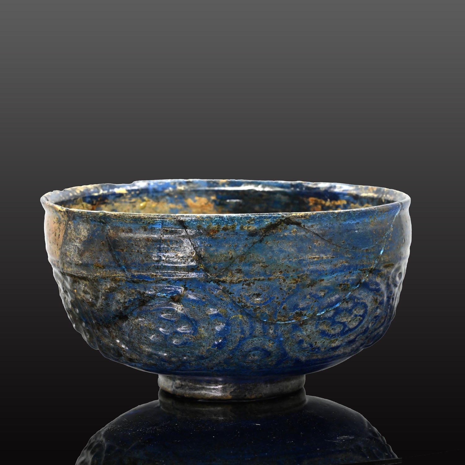 A Rare Islamic Molded Cobalt Blue Glass Bowl, Early Islamic Period, ca. 7th - 10th century CE