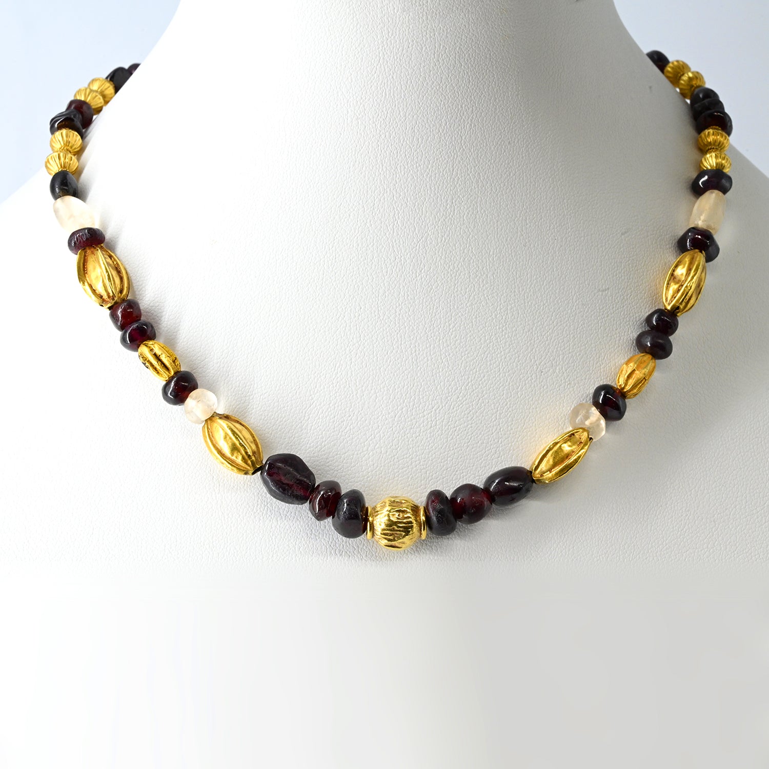 A superb Persian Gold, Garnet, and Crystal Necklace, Achaemenid Period, ca 550 - 300 BCE