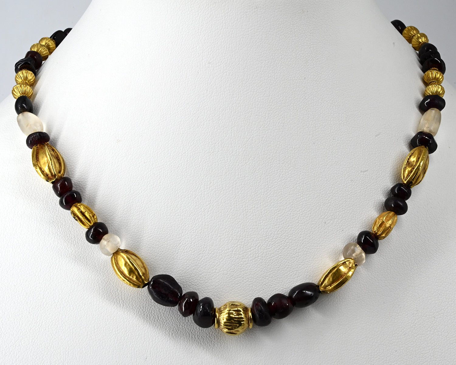A superb Persian Gold, Garnet, and Crystal Necklace, Achaemenid Period, ca 550 - 300 BCE