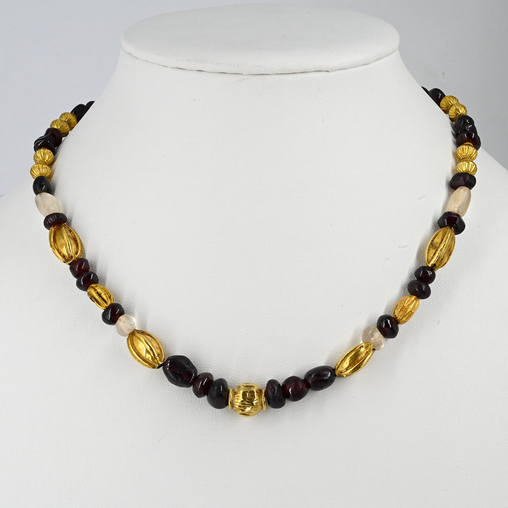 A superb Persian Gold, Garnet, and Crystal Necklace, Achaemenid Period, ca 550 - 300 BCE