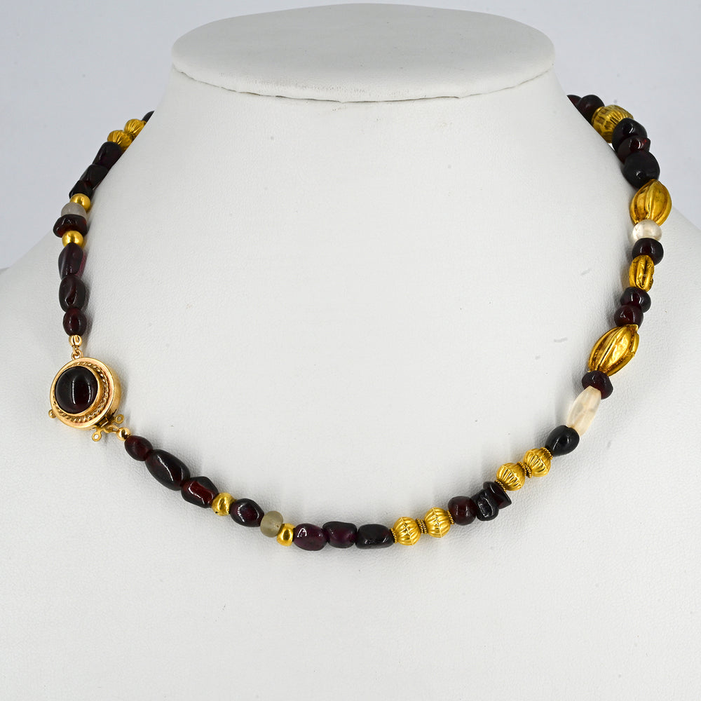 A superb Persian Gold, Garnet, and Crystal Necklace, Achaemenid Period, ca 550 - 300 BCE