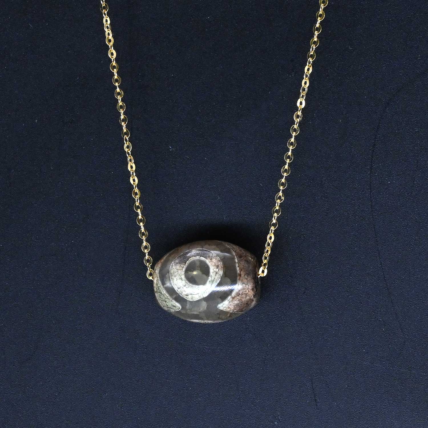 A Near Eastern Eye Agate Bead set as a pendant, ca. 14th century BCE