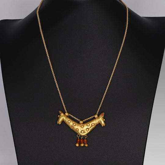 A superb Fatimid Double Horse Head Gold Pendant, ca. 11th - 13th century CE