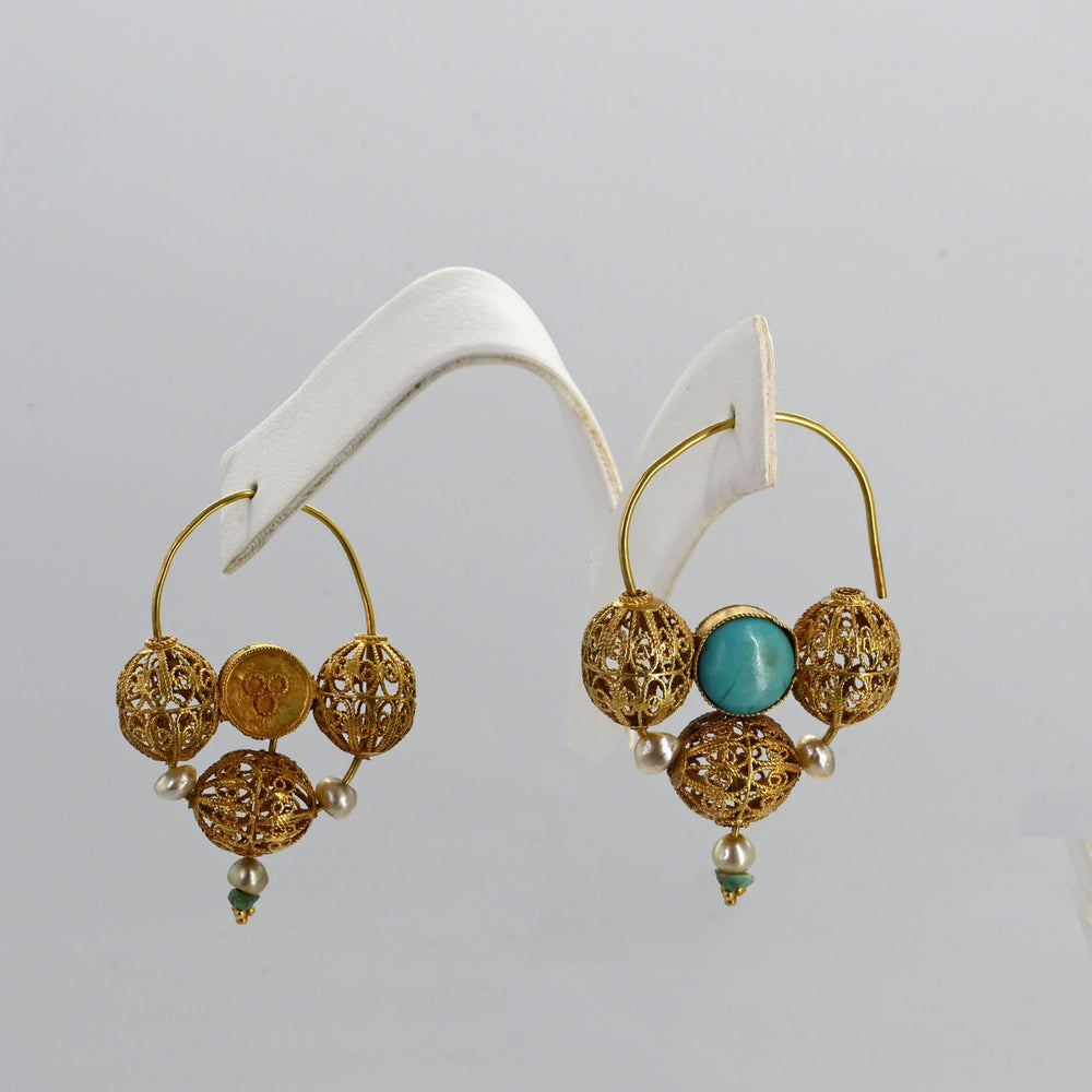 An exceptional pair of Islamic Gold, Turquoise, and Pearl Earrings, ca. 10th century CE