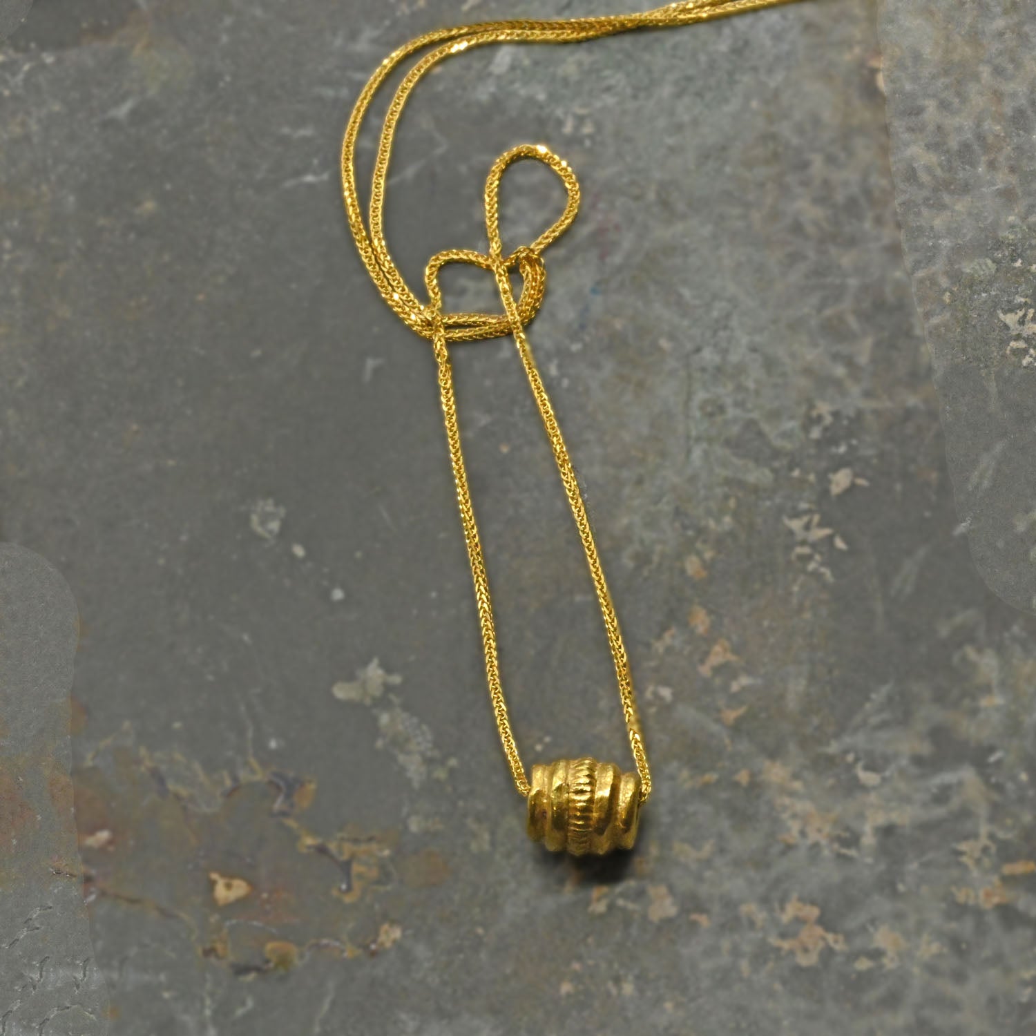 A Persian Gold Bead Pendant, Achaemenid Period, ca. 550 - 330 BCE