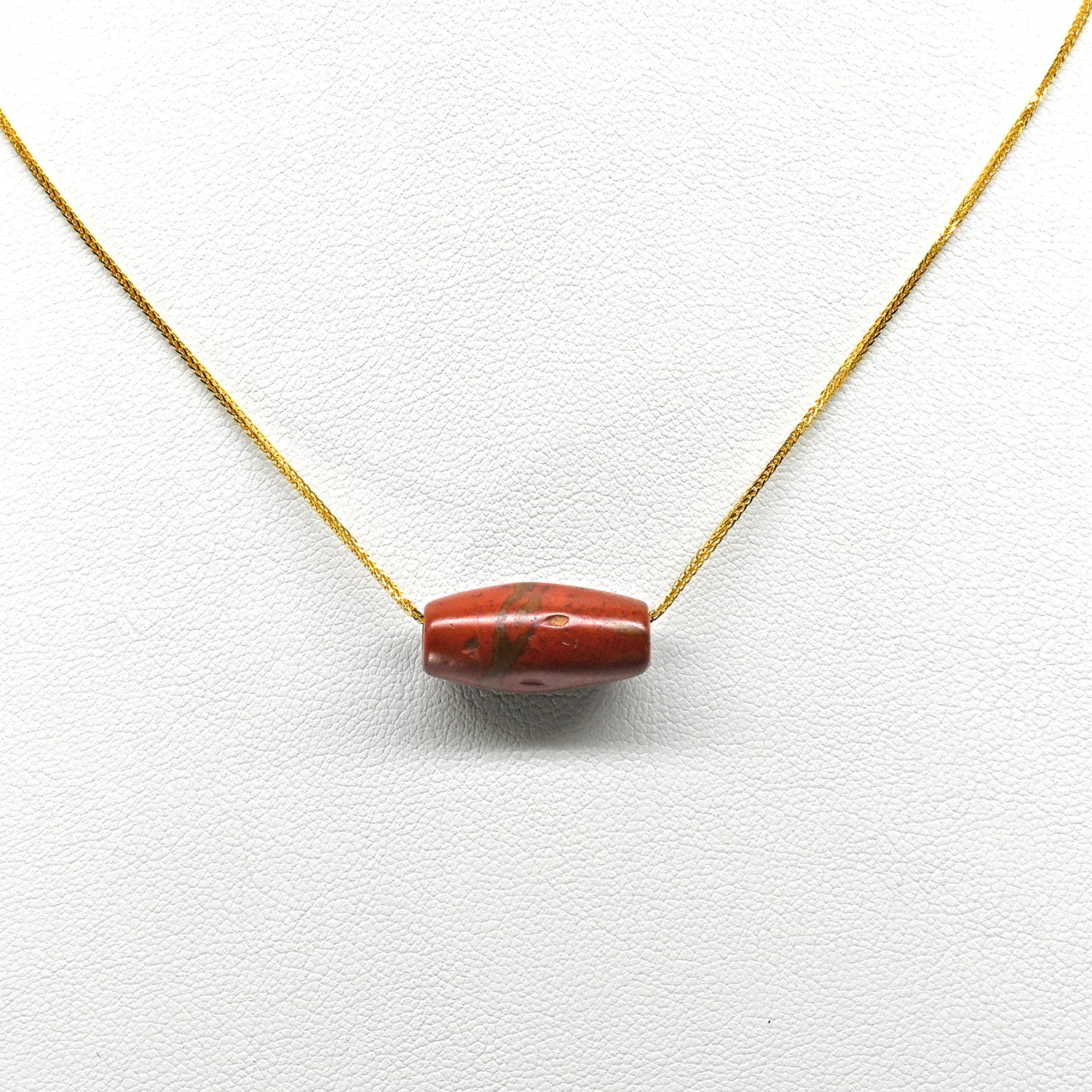 A Near Eastern Red Jasper Bead Pendant, Roman Imperial Period, ca.  1st - 2nd century CE
