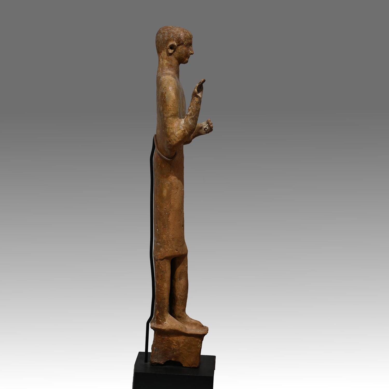 A large Phoenician terracotta standing youth, Neo Assyrian Period, ca. 6th century BCE