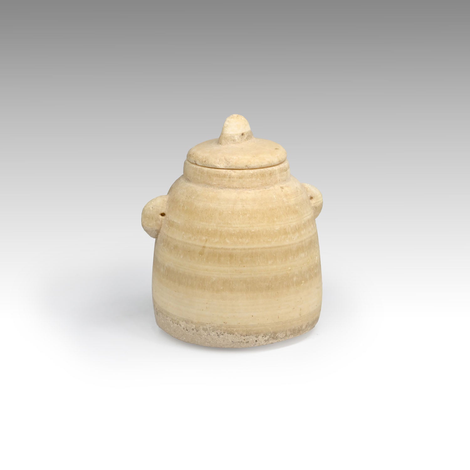 A Biblical "Beehive" Alabaster Jar and Lid, Hellenistic - early Roman Period, ca. 3rd century BCE - 1st century CE