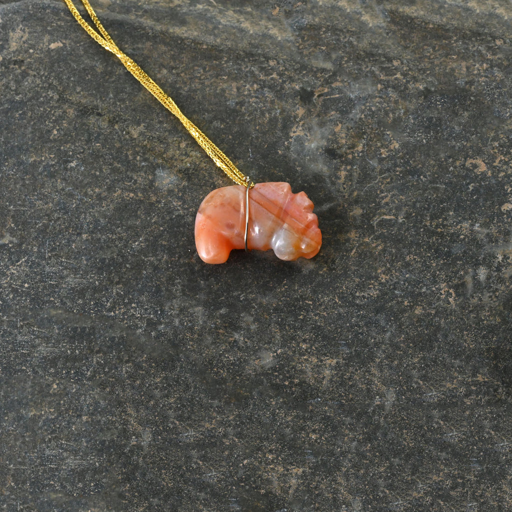 A Tairona Carnelian Gusanos Pendant, Northern Colombia, ca. 800 - 1500 CE