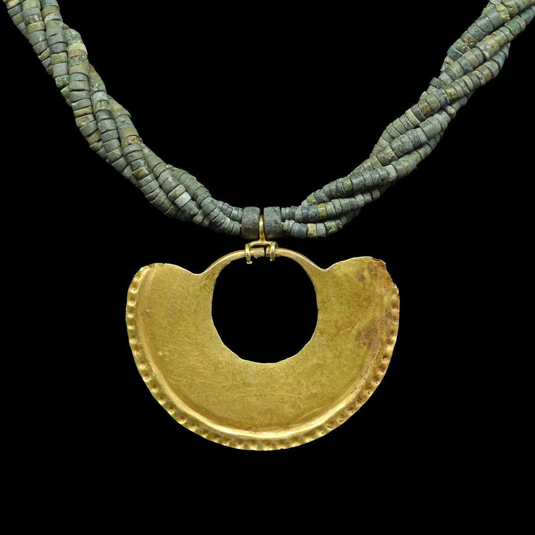 A Sinu Gold Nosering on Beaded Necklace, ca. 800 - 1500 CE