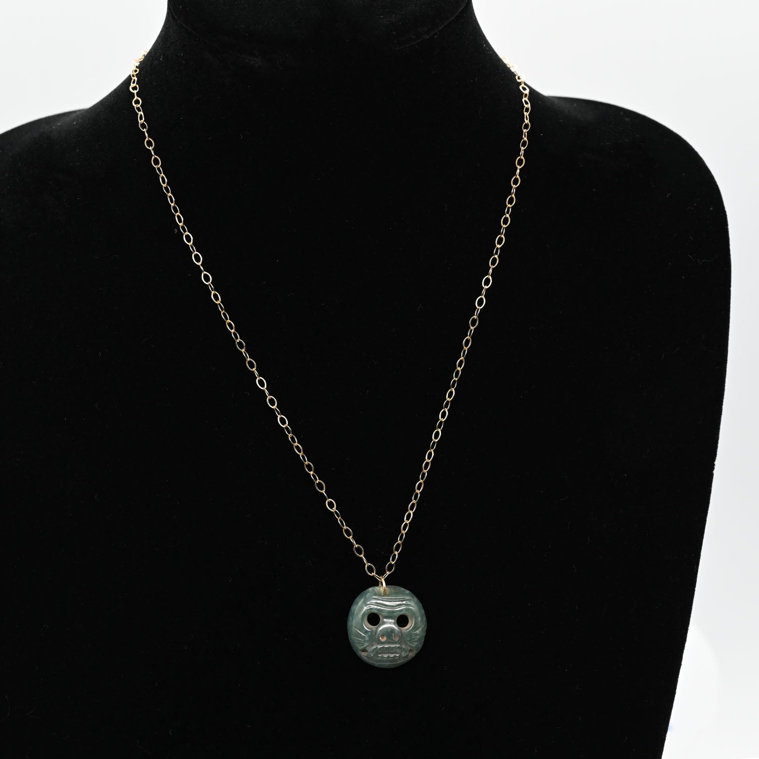 A Maya Jade Jaguar Pendant Necklace, Classic Period, ca. 600–900 CE