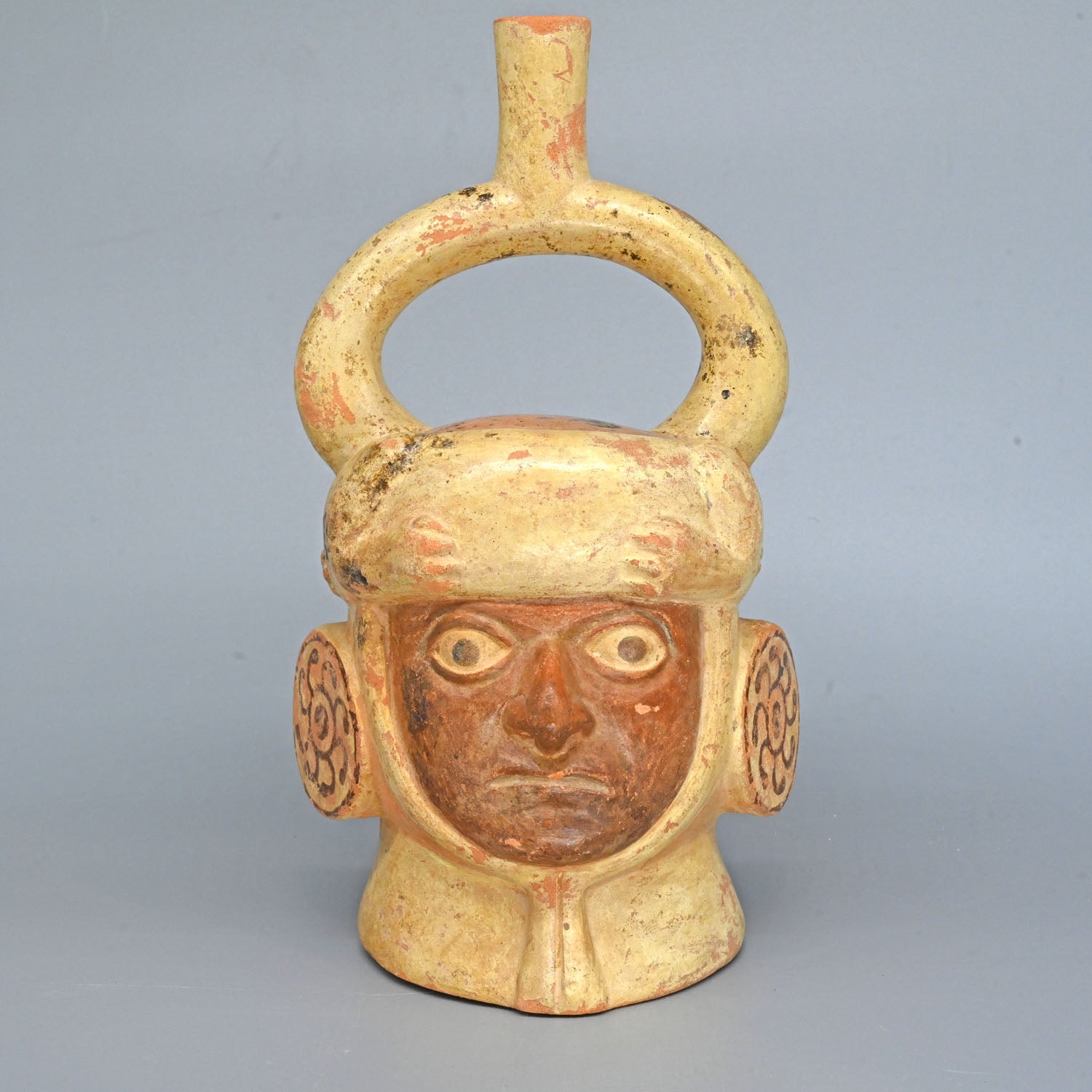 A Moche Stirrup Portrait Head Vessel, Moche III - V, ca. 500 - 800 CE