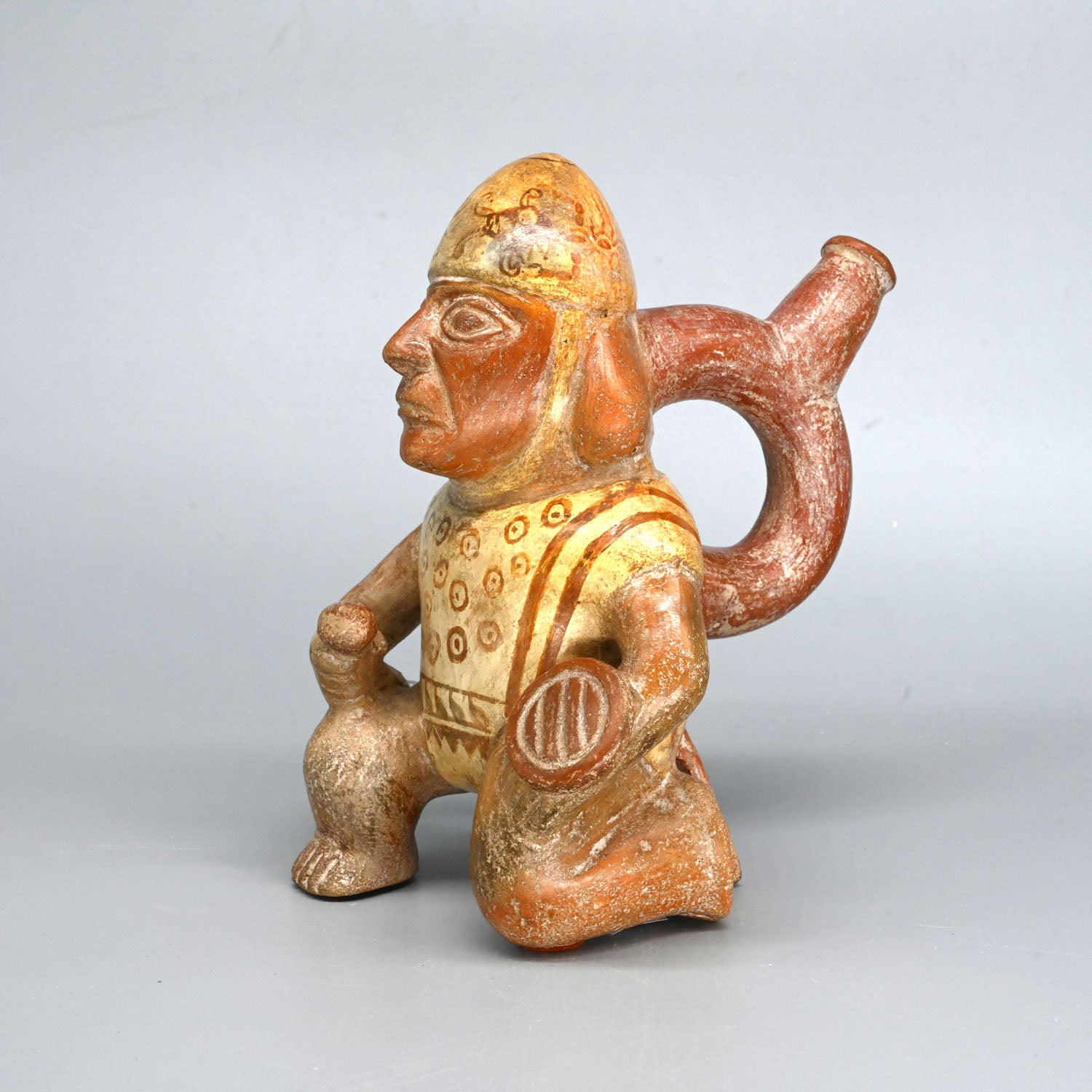 A Moche Kneeling Warrior Stirrup Vessel, Middle Moche Period, ca. 300 - 600 CE