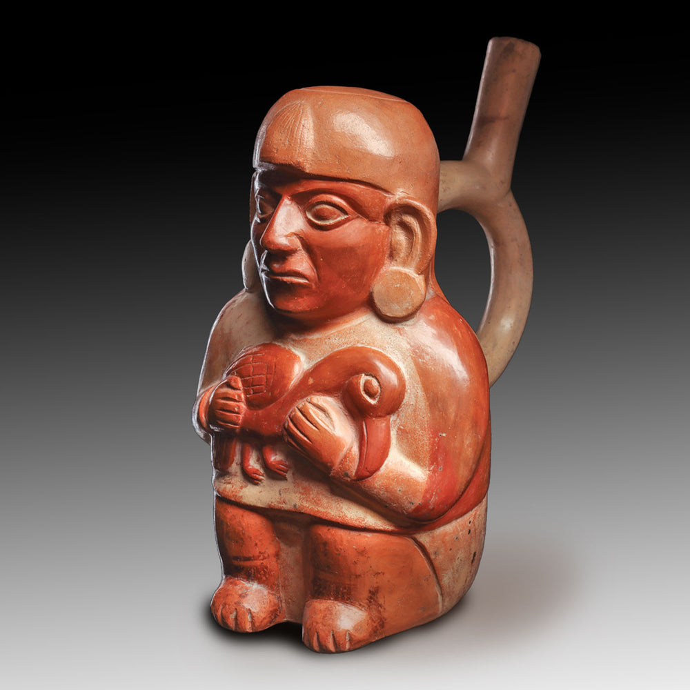 A Moche Effigy Vessel of a Figure Holding a Bird, Early Intermediate Period - Middle Horizon, ca. 200 - 900 CE