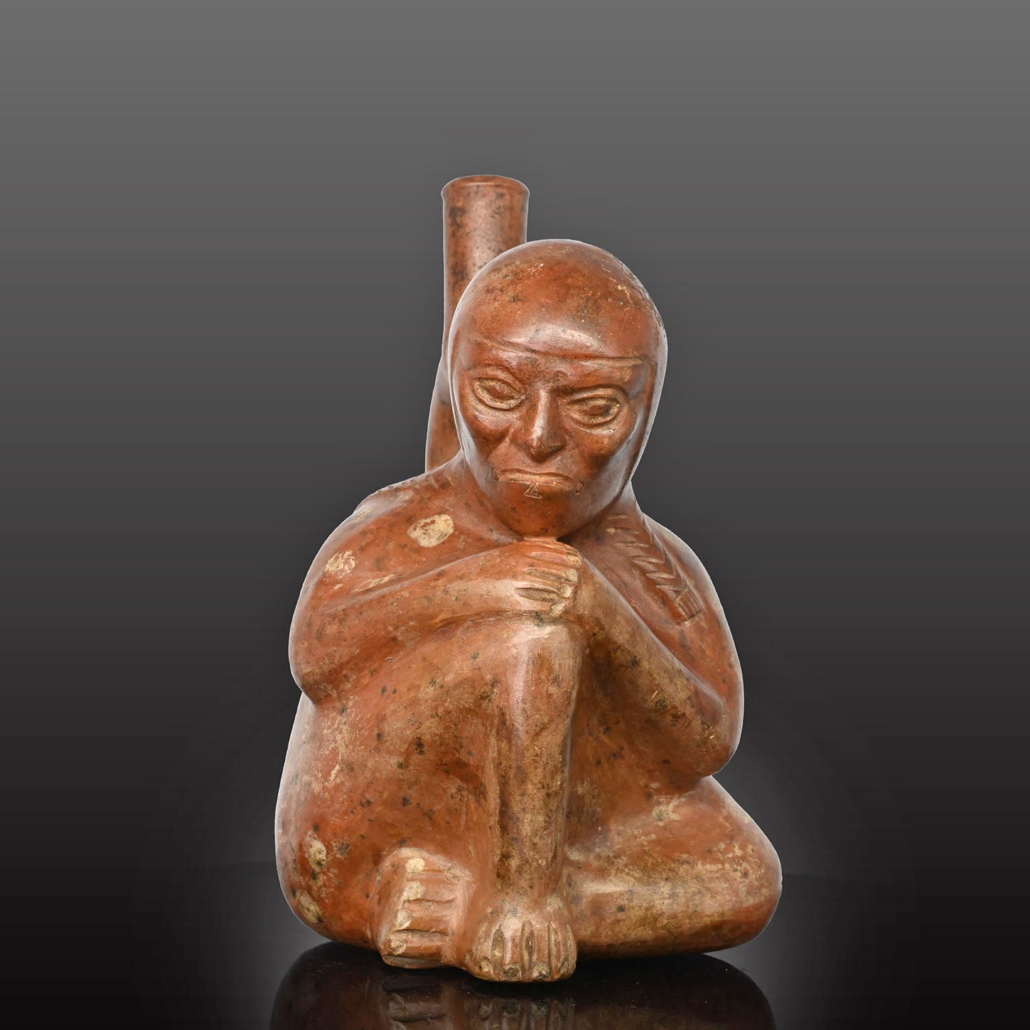 Moche stirrup-spout figural bottle depicting a woman, ca. 300 - 500 CE
