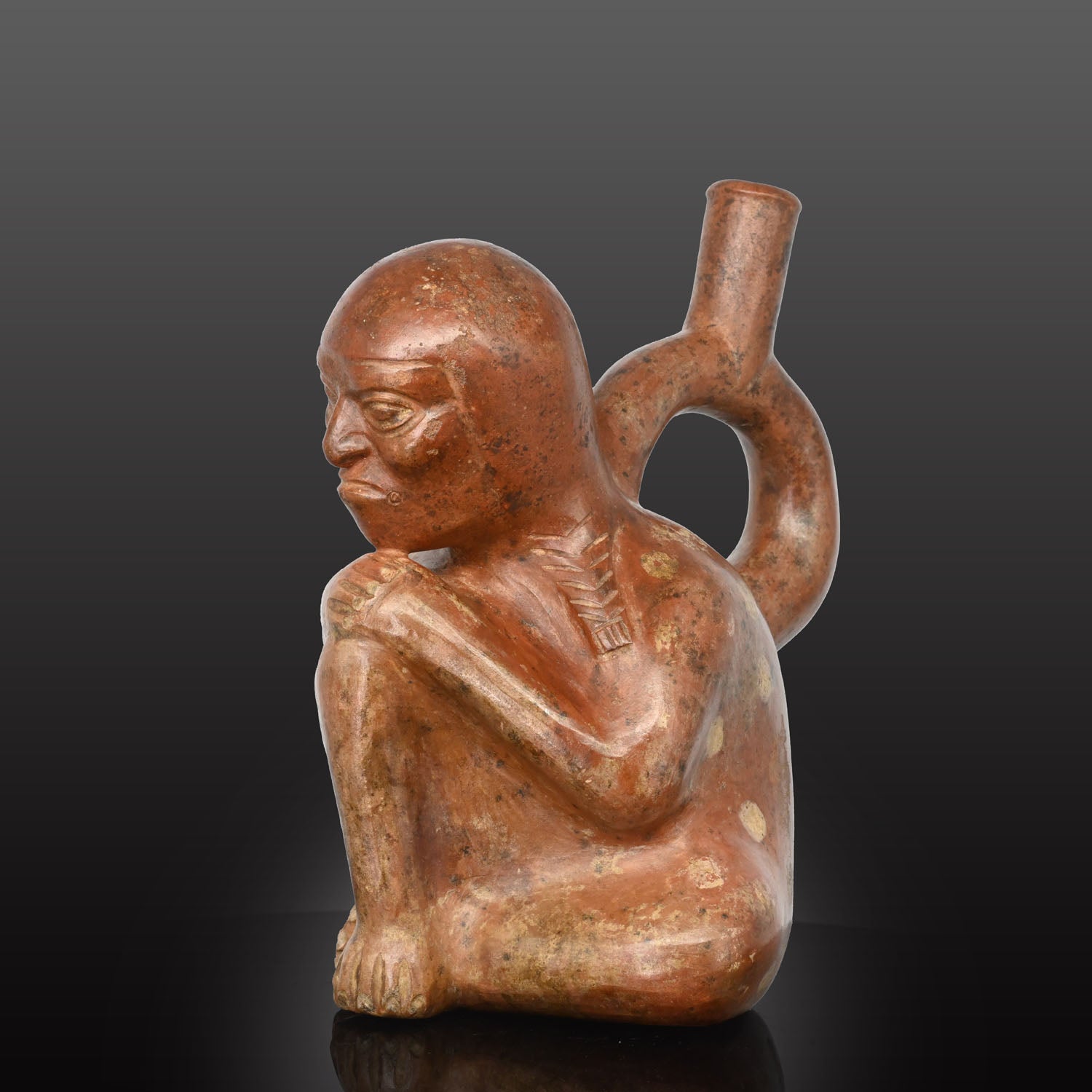 Moche stirrup-spout figural bottle depicting a woman, ca. 300 - 500 CE