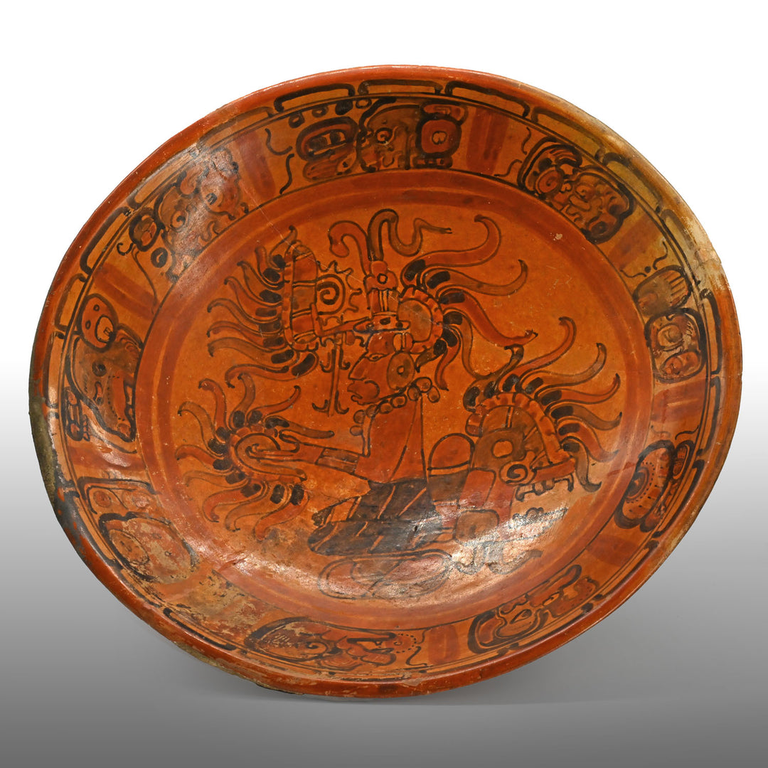 A Large Published Maya Polychrome Plate with Rim Text, Classic Period, ca. 7th – 8th century CE