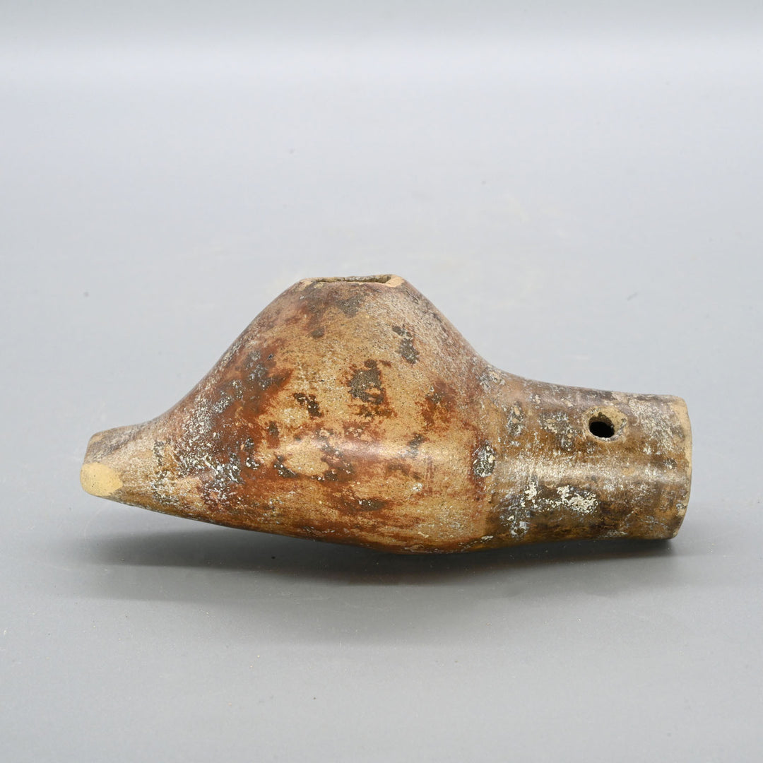 A Narino Pottery Shell Form Ocarina, Classic Period, ca. 500 - 1000 CE