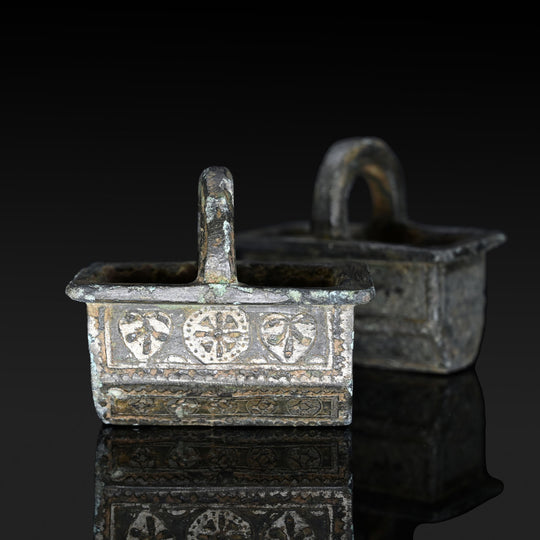 A Pair of Byzantine Copper and Silver Chariot Fittings, Late Roman Imperial Period, ca. 4th century CE