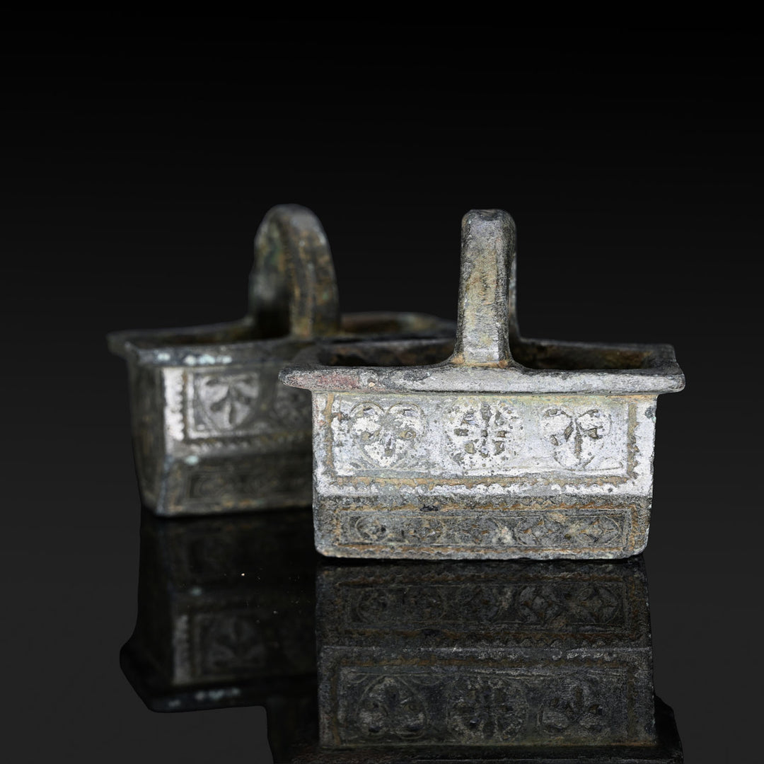 A Pair of Byzantine Copper and Silver Chariot Fittings, Late Roman Imperial Period, ca. 4th century CE