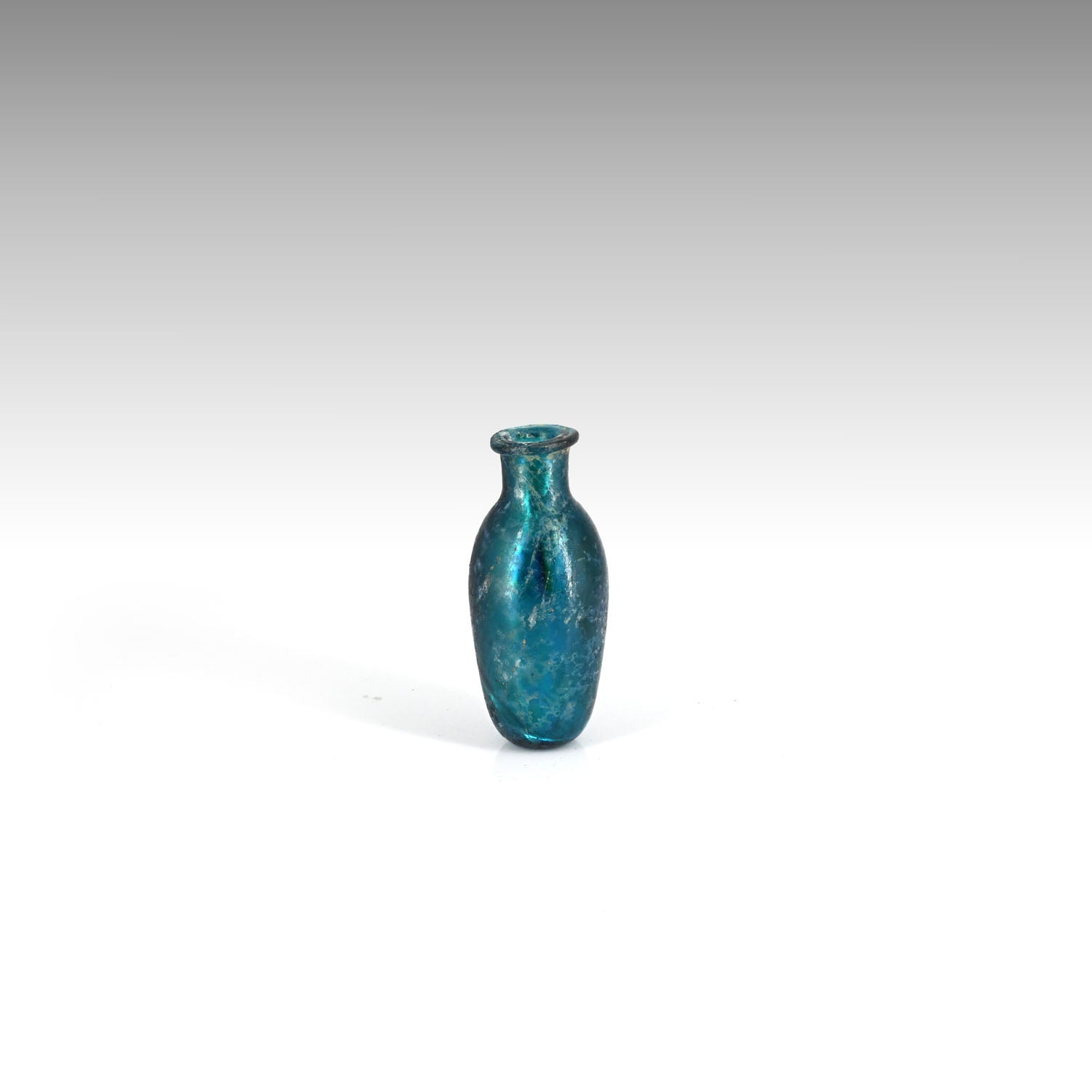 A small Roman Deep Blue Glass Bottle, early 3rd century CE
