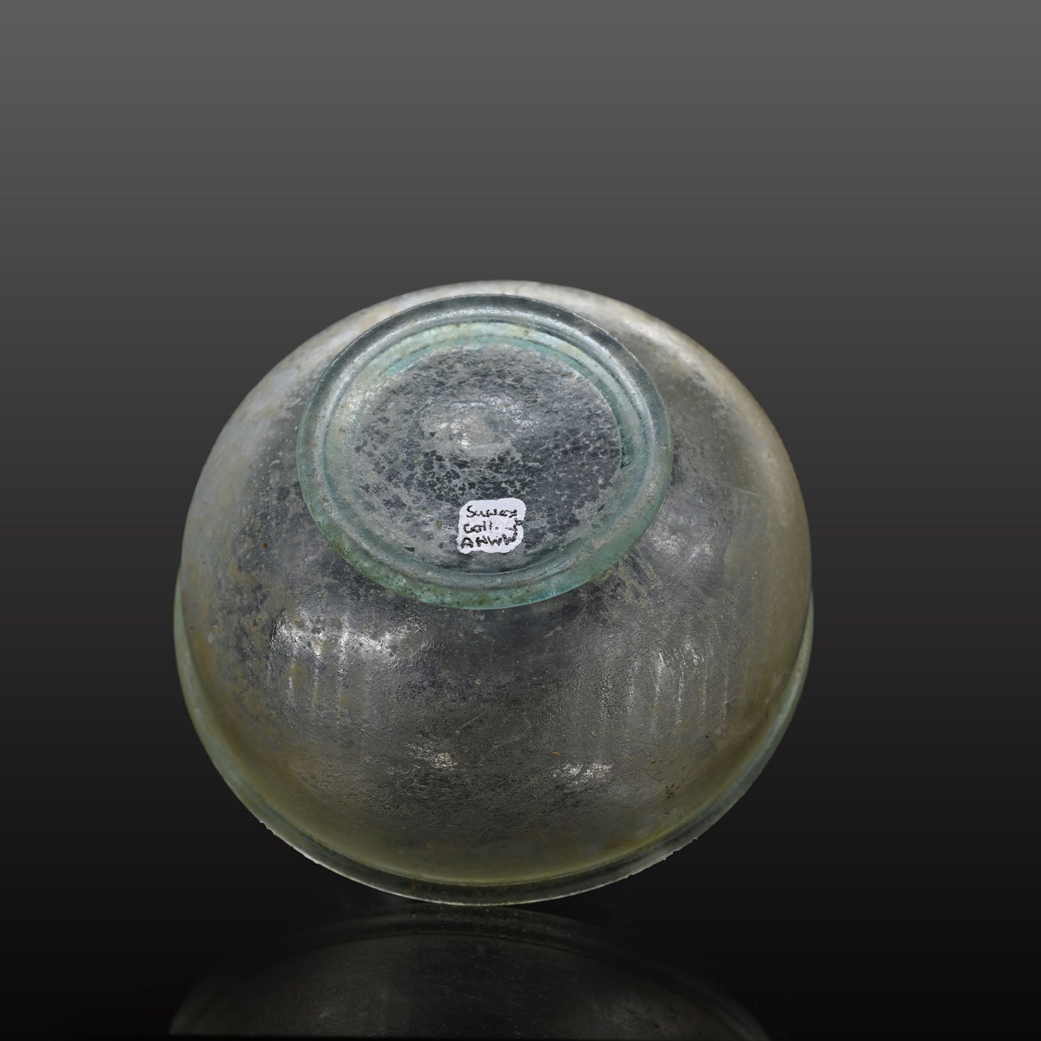 A small Roman Blue-Green Glass Bowl with Foot, Roman Imperial Period, ca. 3rd century CE