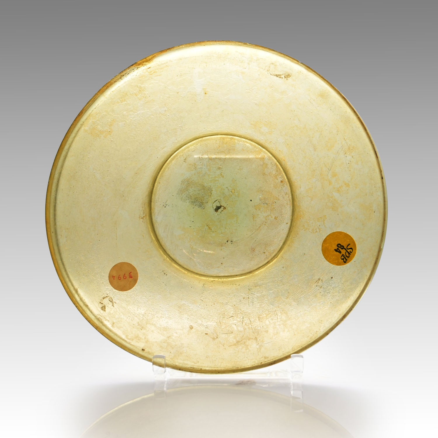 A Roman Yellow Glass Plate, Roman Imperial Period,  ca. 1st century CE