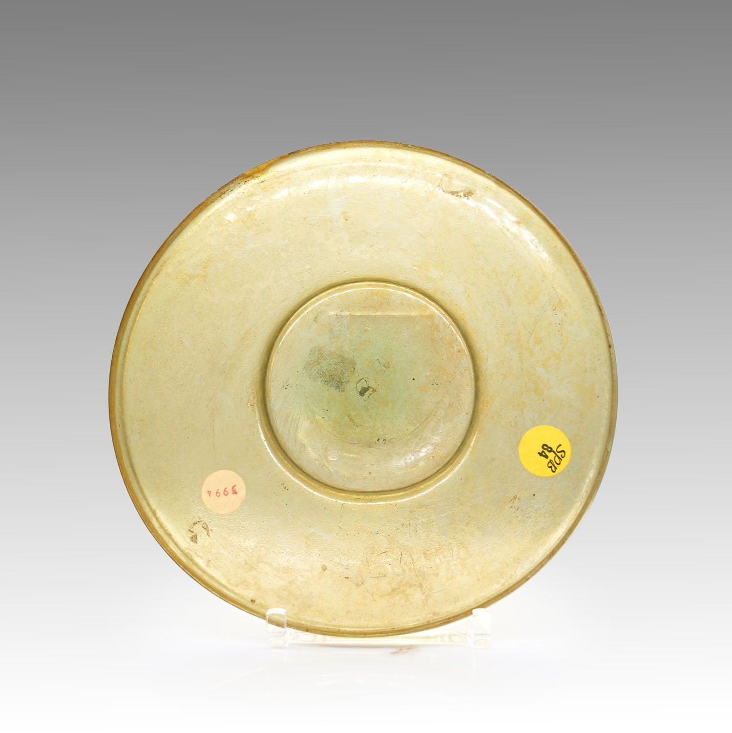 A Roman Yellow Glass Plate, Roman Imperial Period,  ca. 1st century CE
