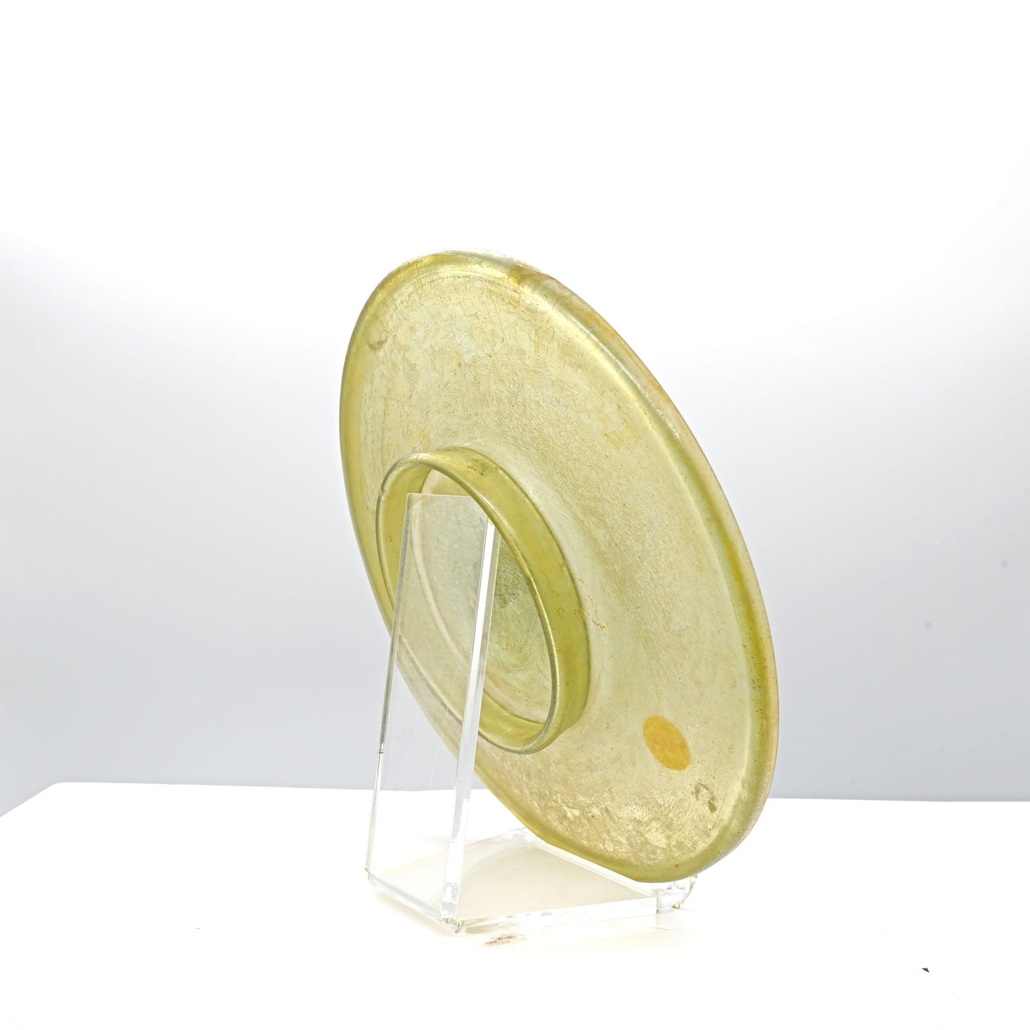 A Roman Yellow Glass Plate, Roman Imperial Period,  ca. 1st century CE