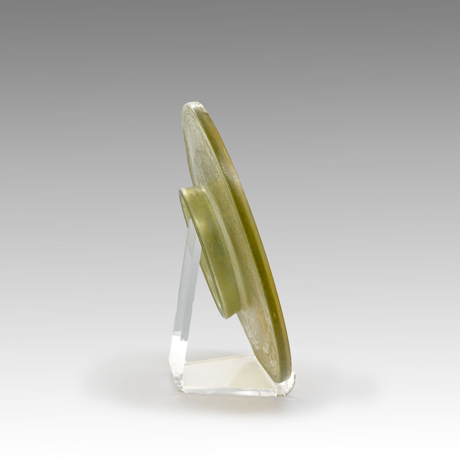 A Roman Yellow Glass Plate, Roman Imperial Period,  ca. 1st century CE