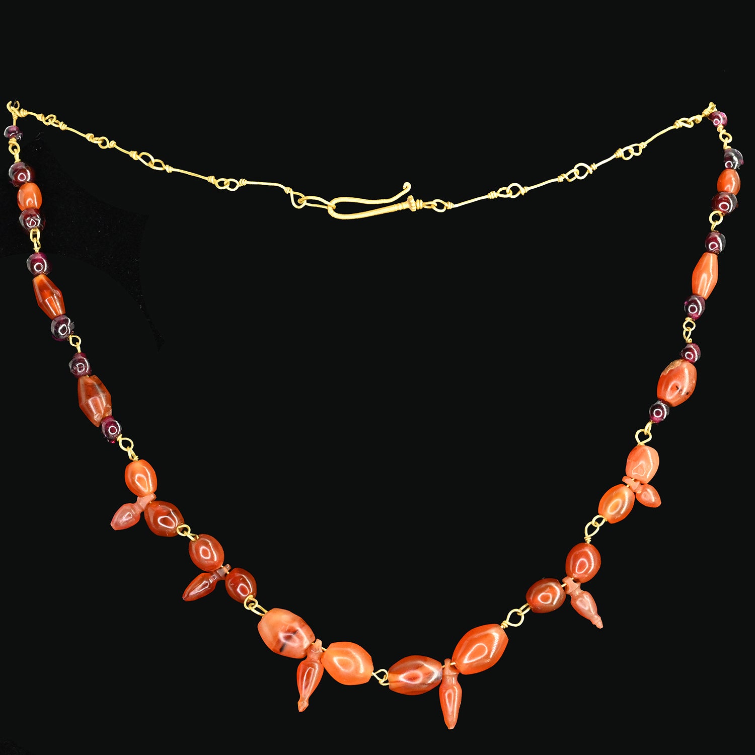 A Roman Carnelian and Garnet Necklace with Amphora Shaped Pendants, Roman Imperial Period, ca. 2nd - 3rd century CE