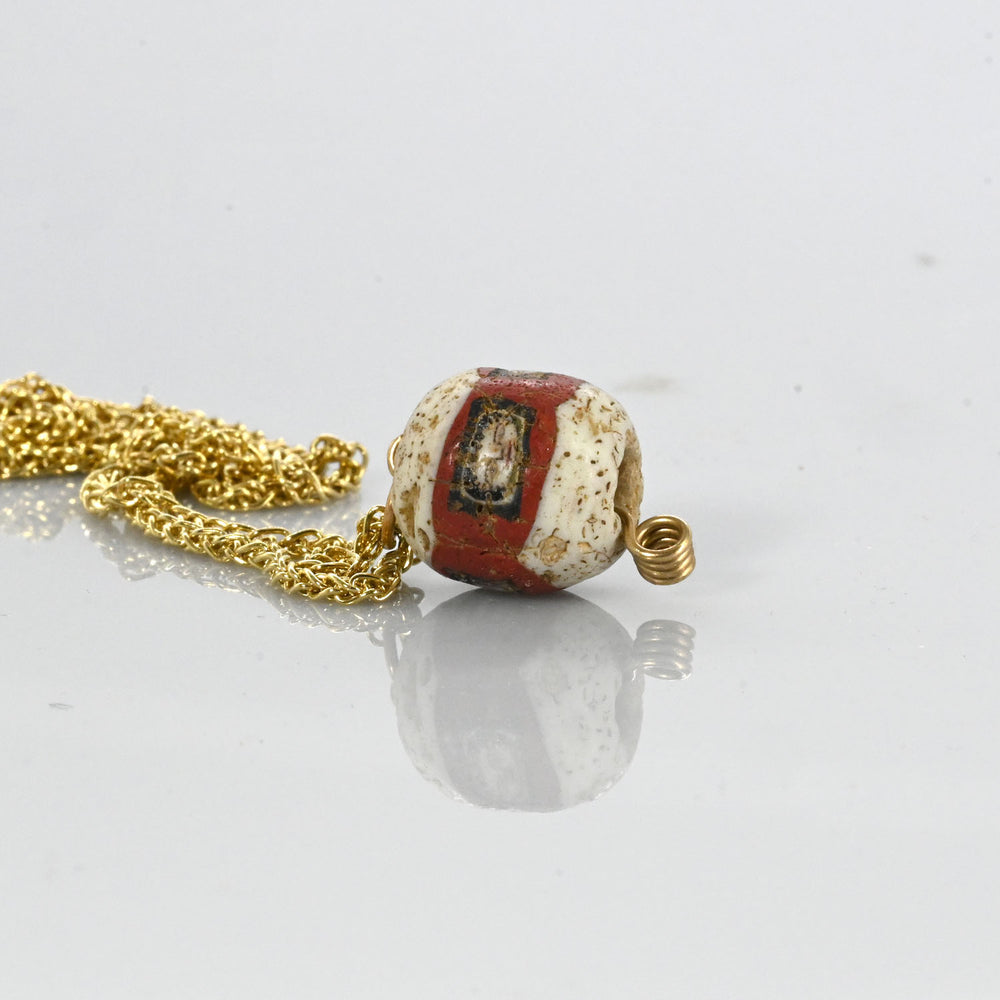 A fine Roman Glass Portrait Head Bead, Roman Imperial Period, ca. 100 - 200 CE