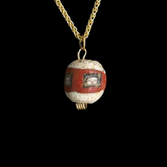 A fine Roman Glass Portrait Head Bead, Roman Imperial Period, ca. 100 - 200 CE