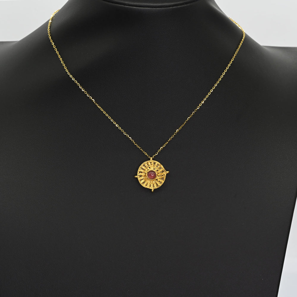 A Byzantine Gold and Garnet Pendant, Eastern Mediterranean, ca. 6th–7th century CE