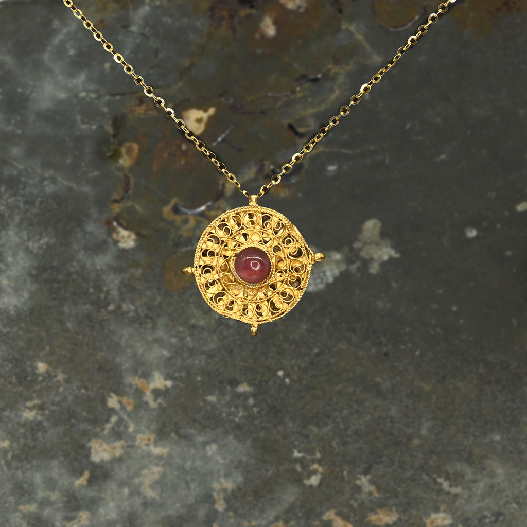 A Byzantine Gold and Garnet Pendant, Eastern Mediterranean, ca. 6th–7th century CE