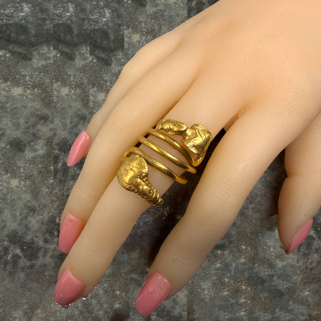 A Published Egypto-Roman Gold Spiral Snake Ring with Isis and Ptah Terminals, Roman Imperial Period, ca. 1st century CE