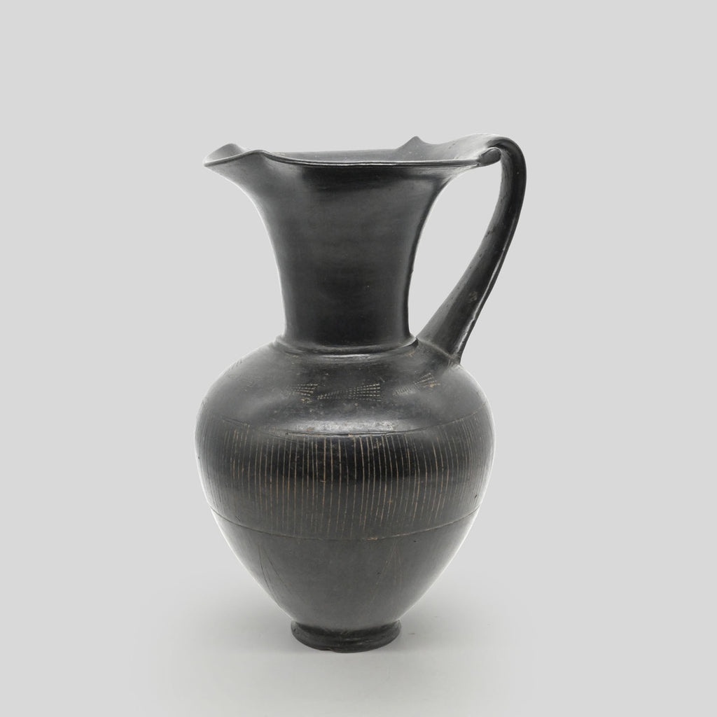 A published Etruscan Bucchero Pitcher, ca. 6th century BCE